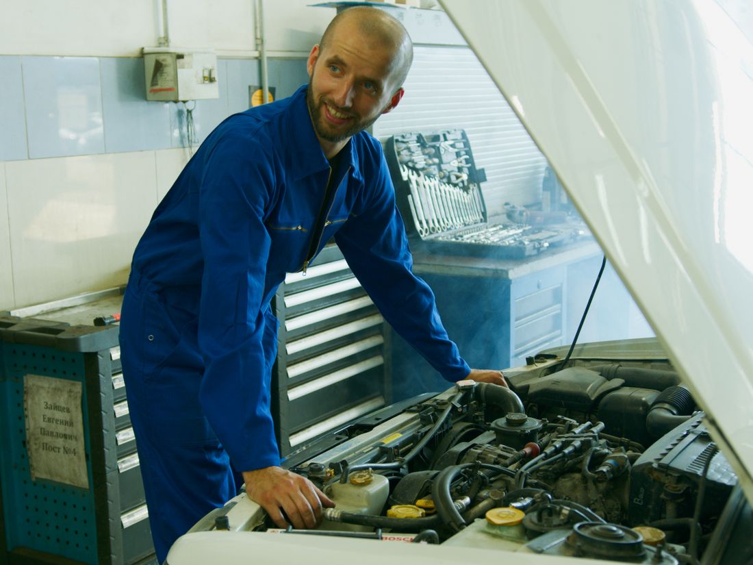 A technician working in an auto repair bay