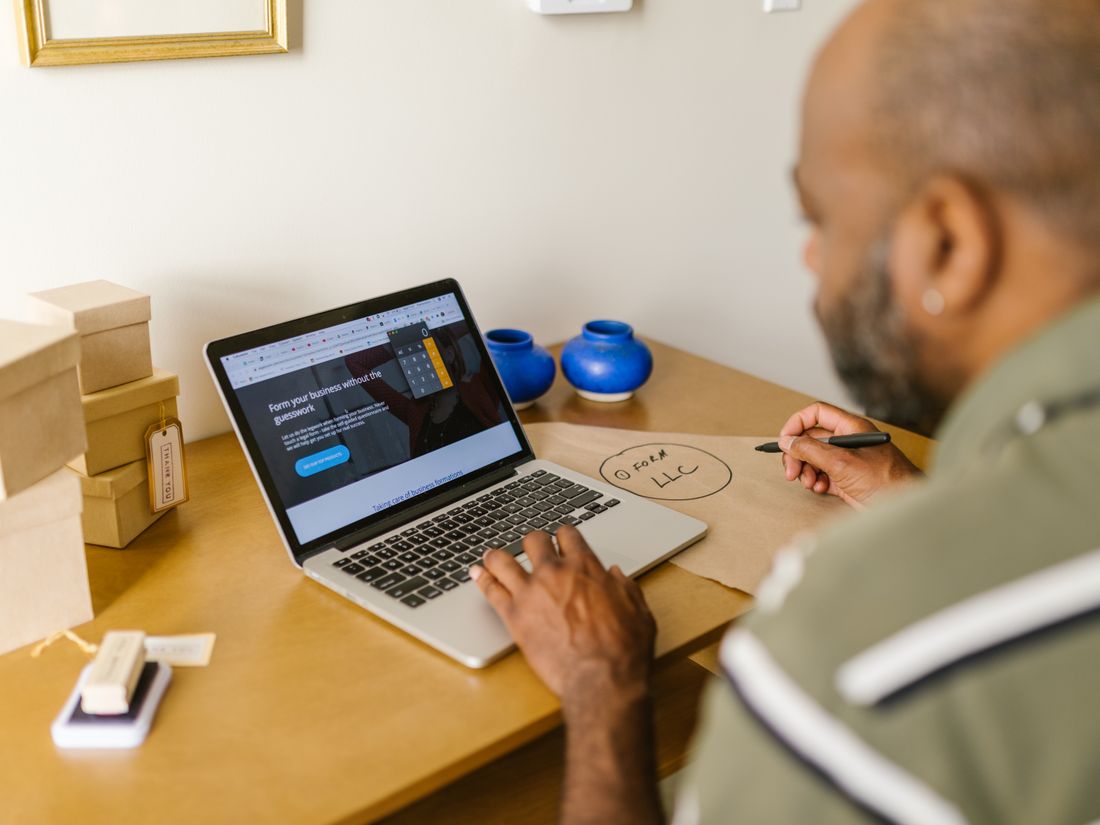 A small-business owner reviewing finances