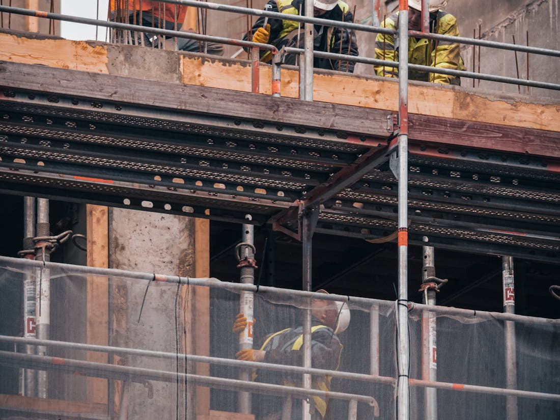 A contractor reviewing plans on a job site